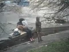 A spy video shows a sexually aroused female fucking her boyfriend outside in a public park.
